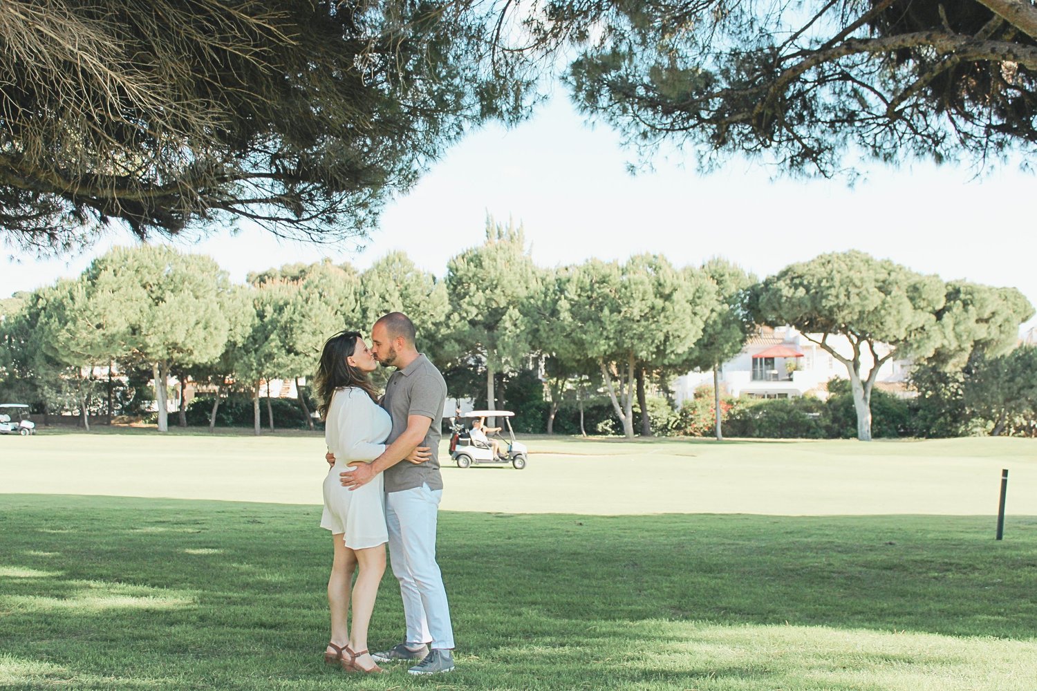 Couple kissing on a green, Algarve
