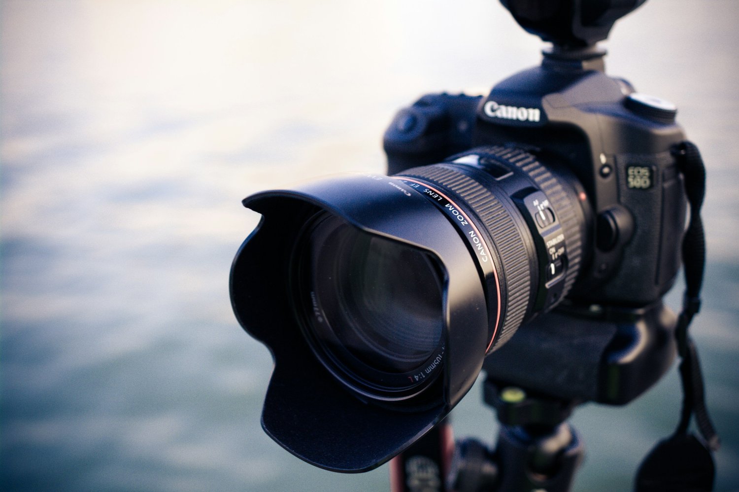 Professional camera on a tripod by the sea
